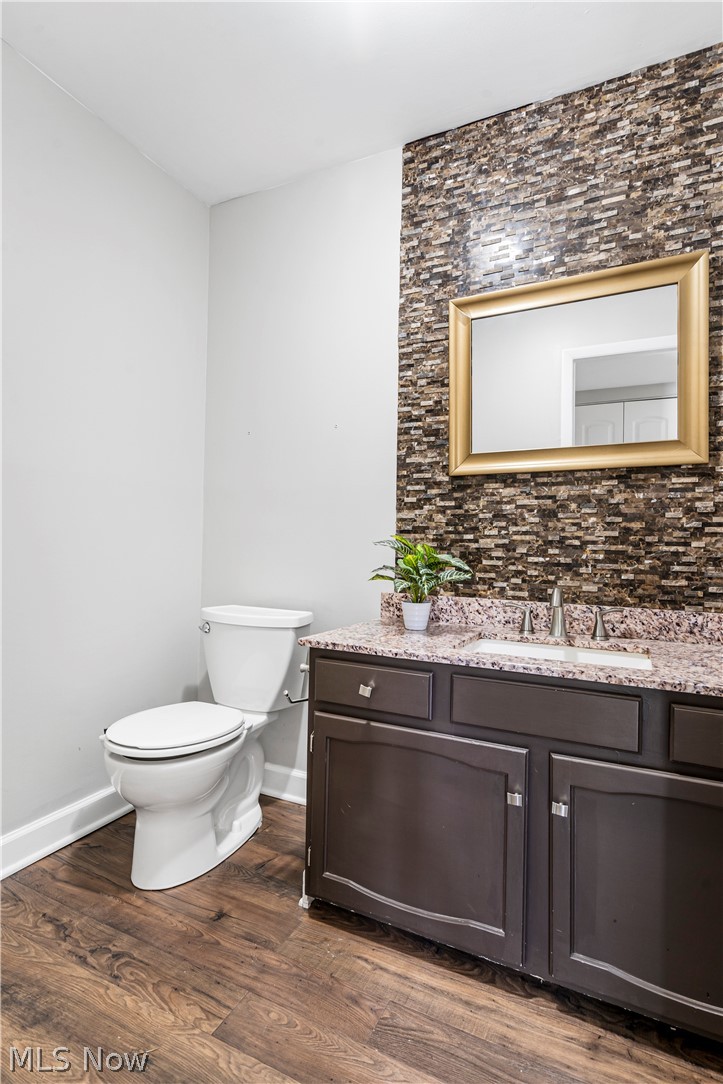 3428 South Smith Road Fairlawn, OH 44333 - Photo 5 of 30 Bathroom featuring toilet, vanity, and hardwood / wood-style flooring