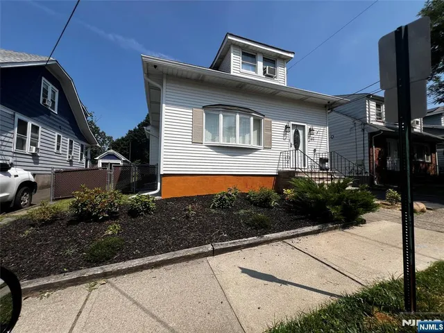 a front view of a house with yard