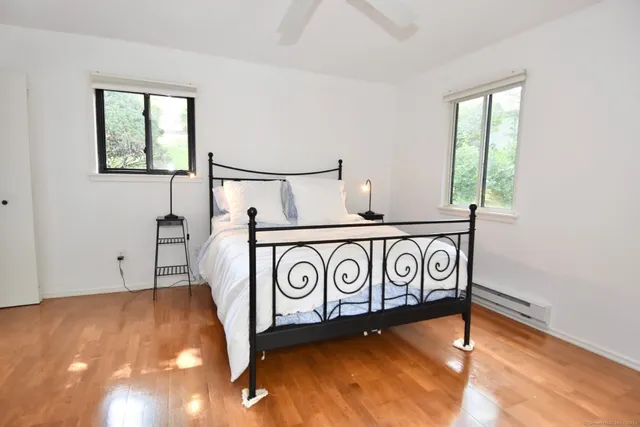 a view of a room with window and wooden floor