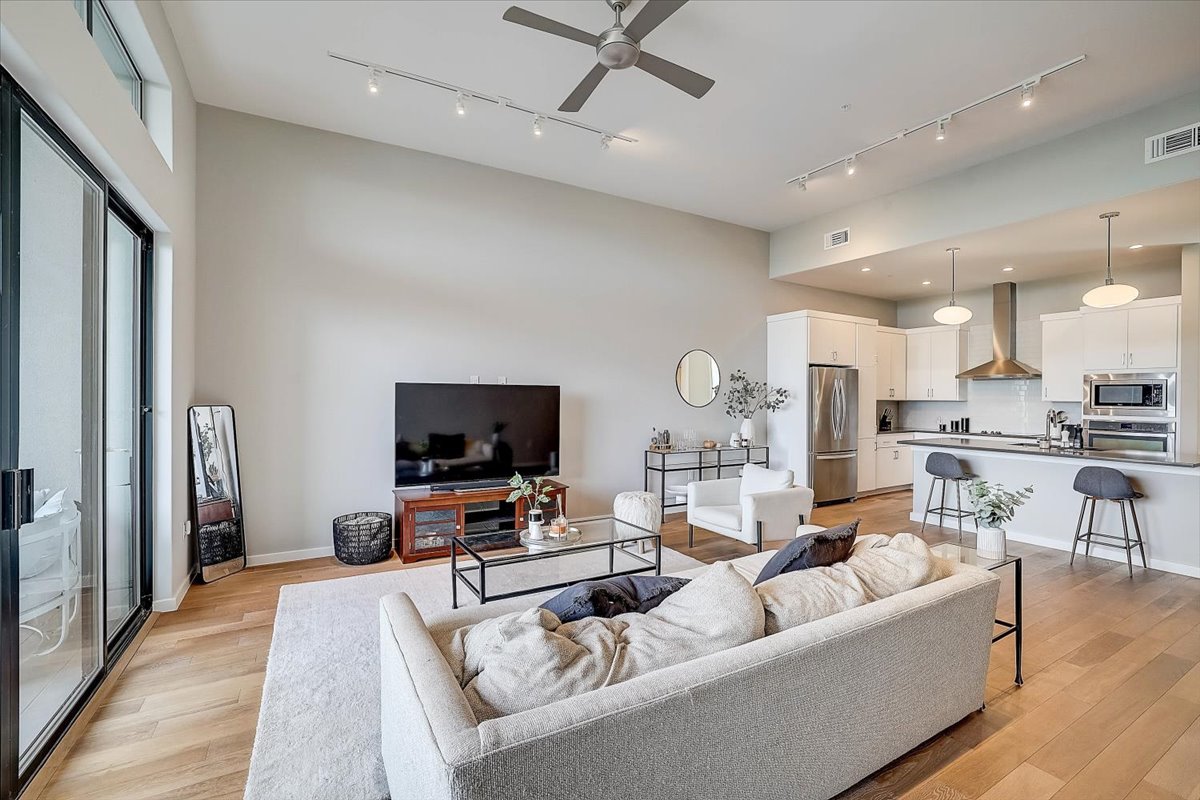 5921 Hiline Road, Unit 1204 Austin, TX 78734 - Photo 6 of 36 Living room featuring ceiling fan and light wood-type flooring