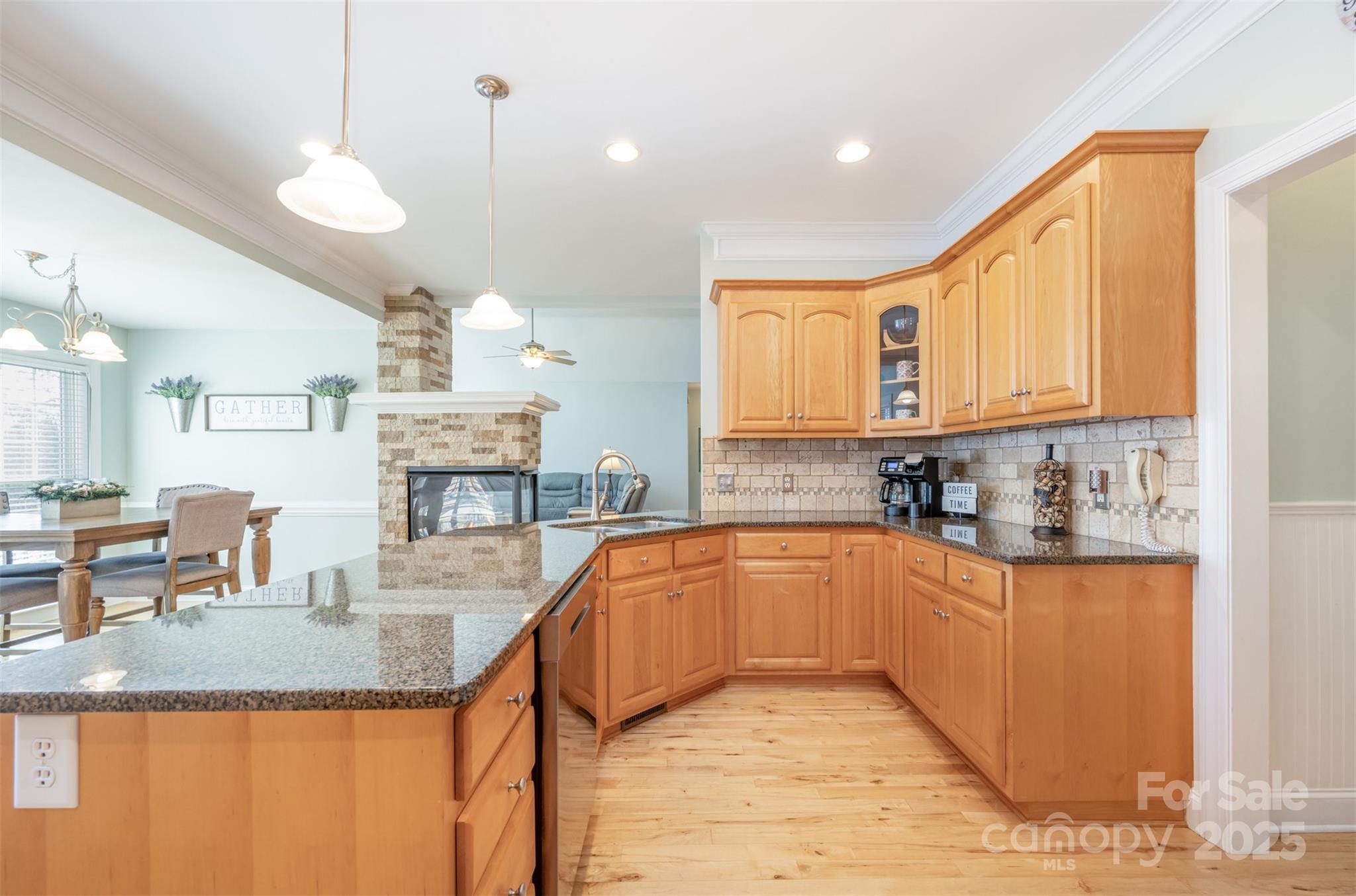 9467 Hester Court Harrisburg, NC 28075 - Photo 12 of 48 a kitchen with stainless steel appliances granite countertop a sink a stove and cabinets