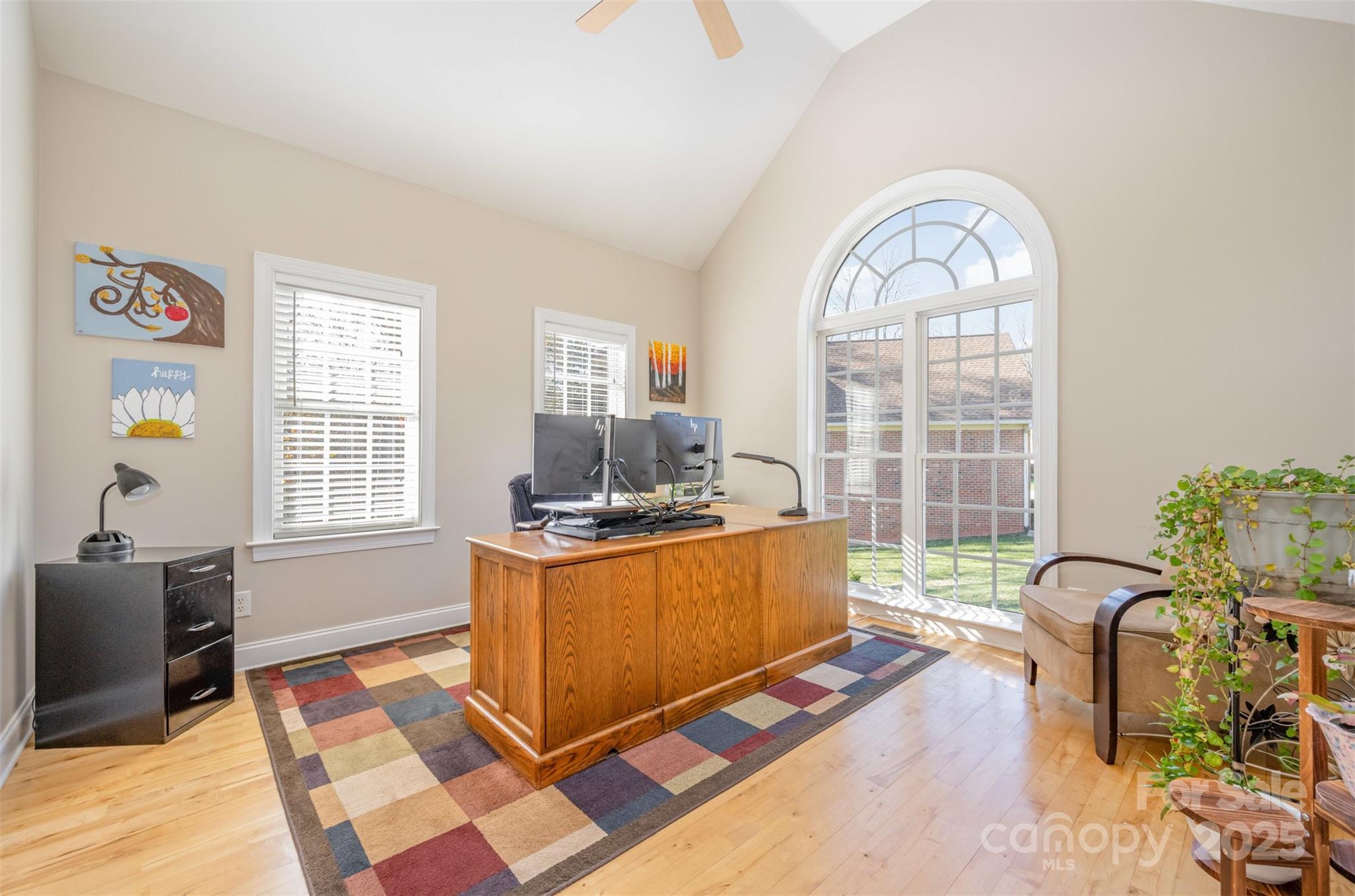 9467 Hester Court Harrisburg, NC 28075 - Photo 18 of 48 a living room with furniture a flat screen tv and a window
