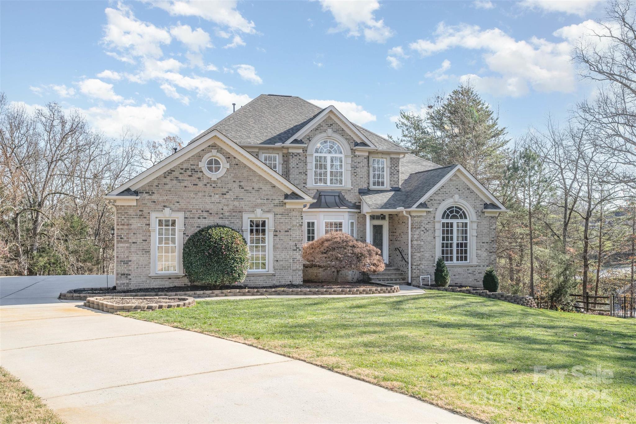 9467 Hester Court Harrisburg, NC 28075 - Photo 2 of 48 a front view of a house with a yard