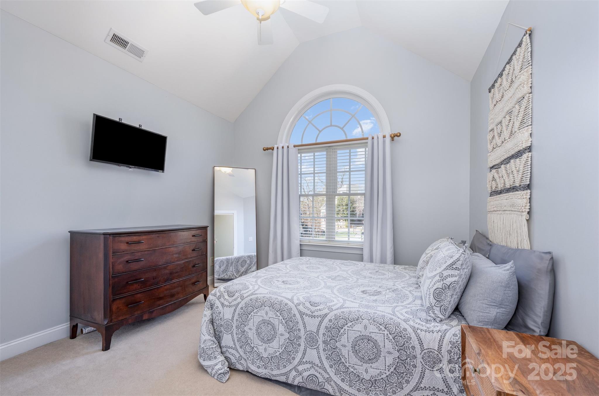 9467 Hester Court Harrisburg, NC 28075 - Photo 25 of 48 a bedroom with a bed and a television