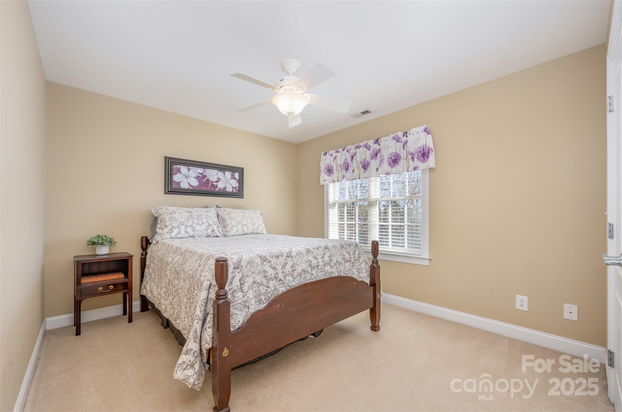 9467 Hester Court Harrisburg, NC 28075 - Photo 28 of 48 a bed sitting in a bedroom next to a window
