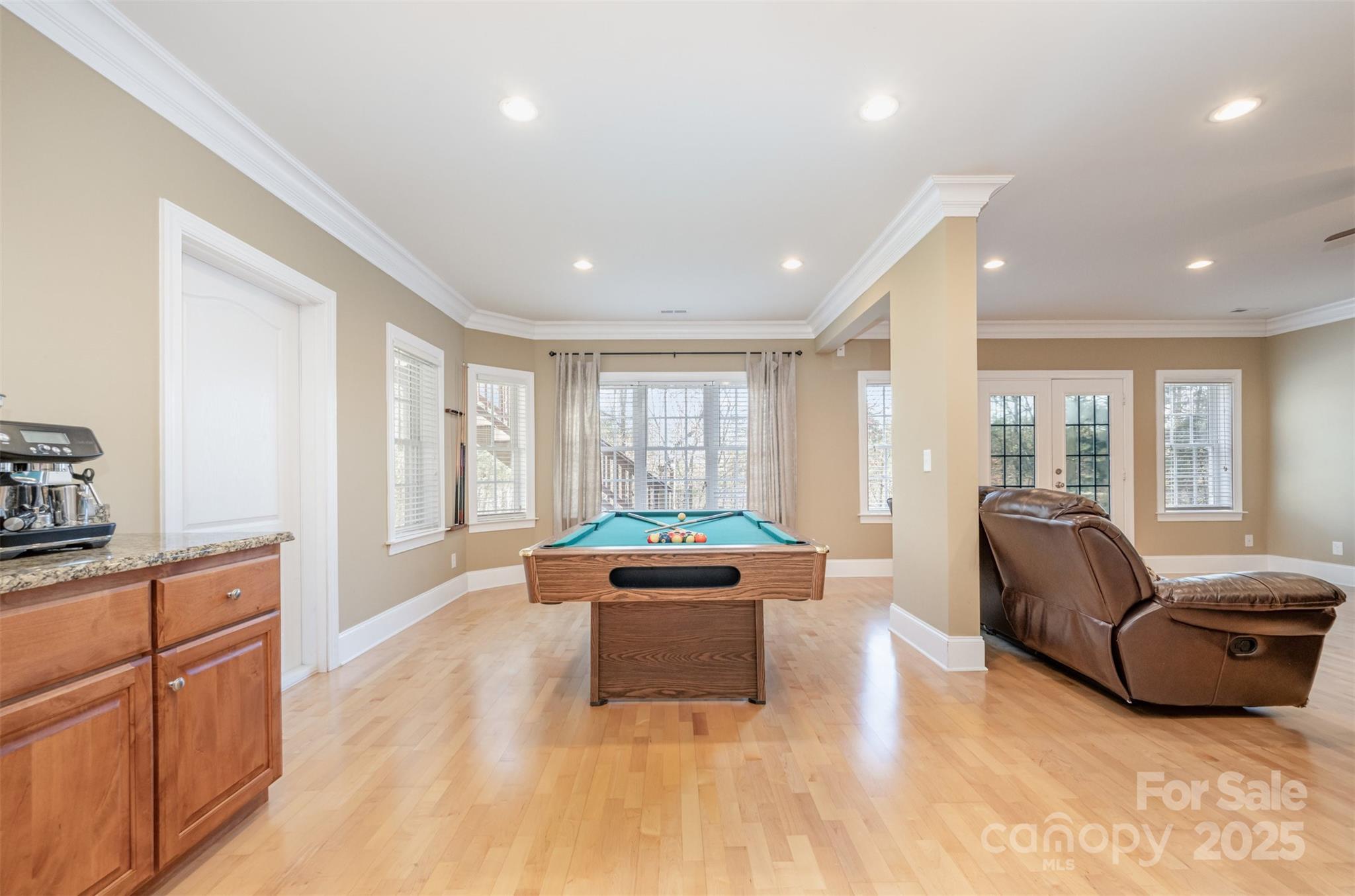 9467 Hester Court Harrisburg, NC 28075 - Photo 32 of 48 a living room with furniture and a large window