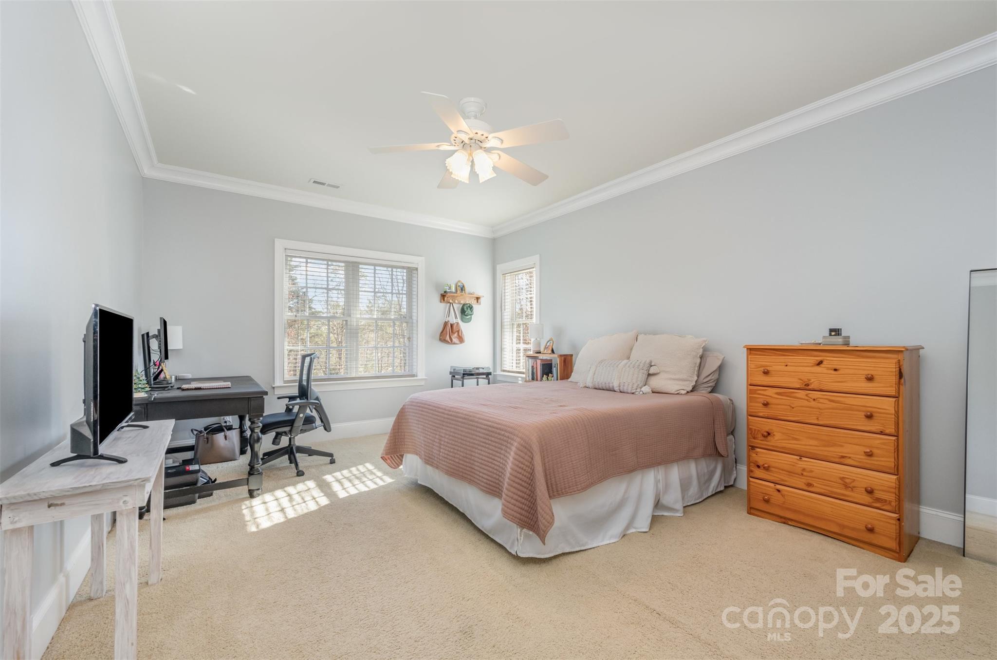 9467 Hester Court Harrisburg, NC 28075 - Photo 34 of 48 a spacious bedroom with a bed and furniture