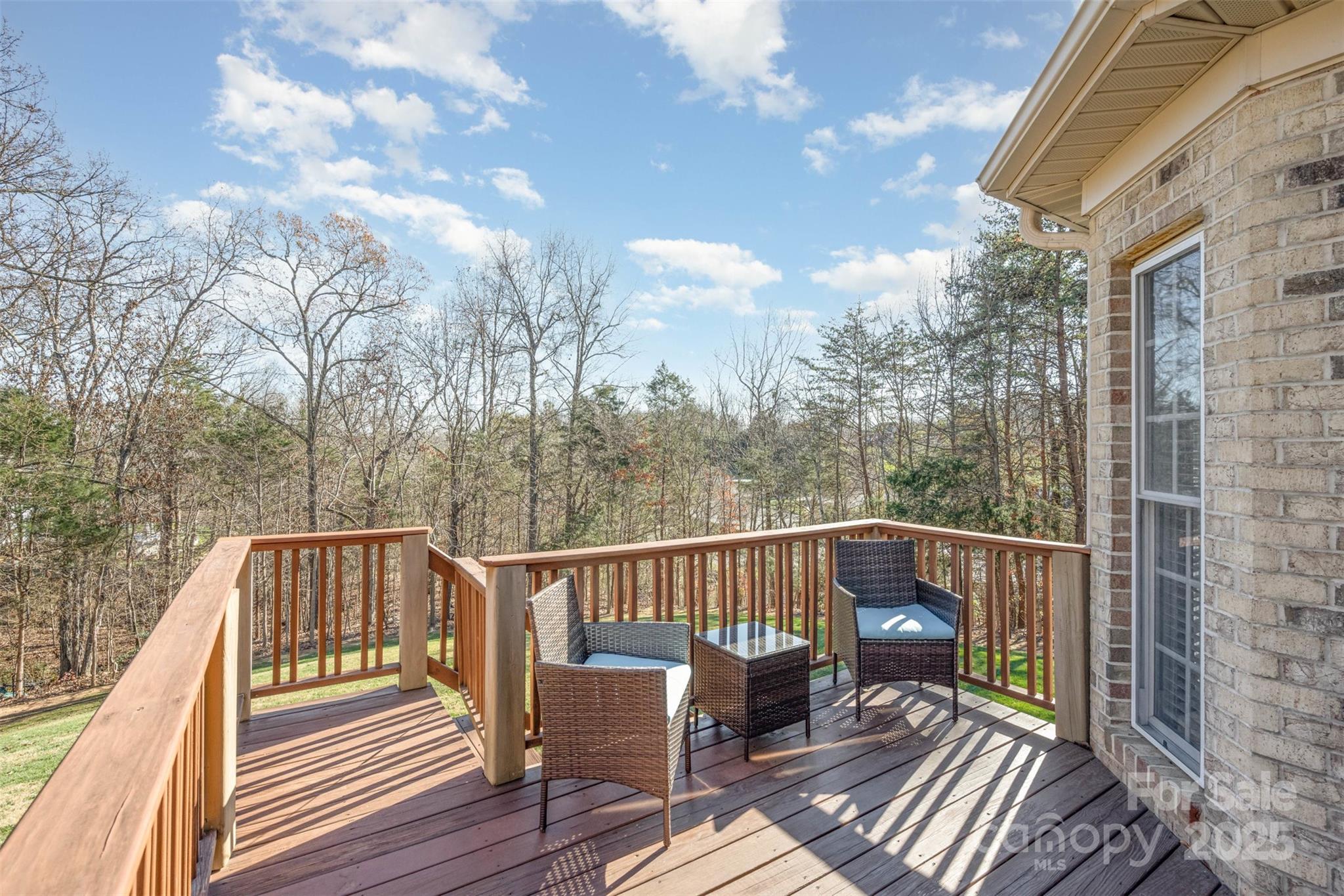 9467 Hester Court Harrisburg, NC 28075 - Photo 41 of 48 a view of a balcony with wooden floor and bench