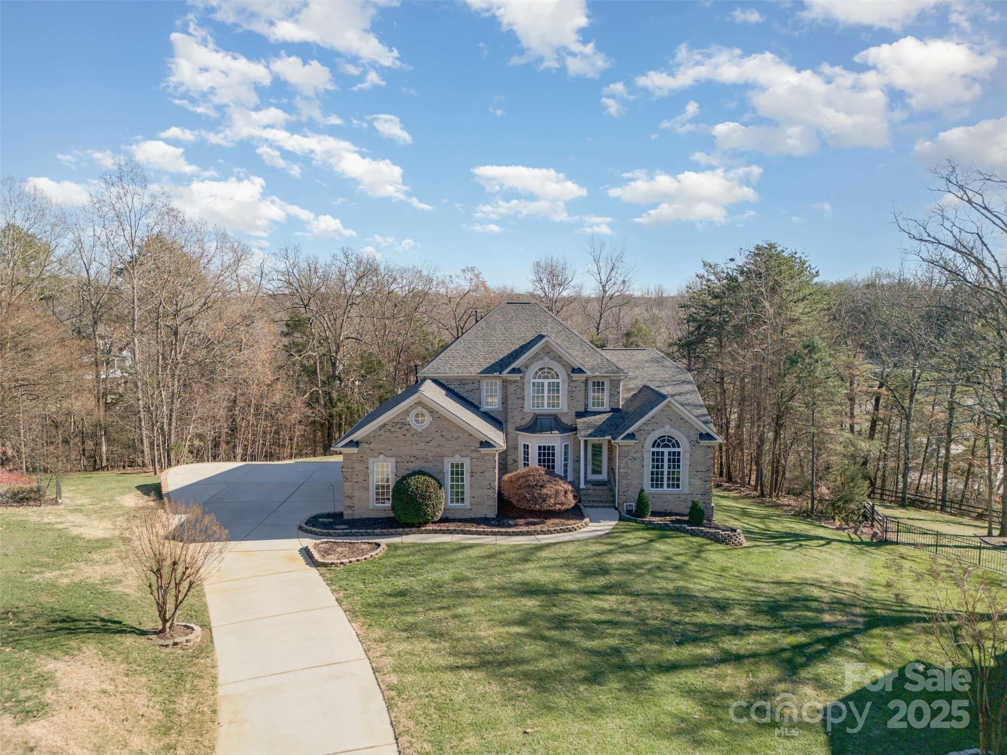 9467 Hester Court Harrisburg, NC 28075 - Photo 45 of 48 a front view of a house with garden