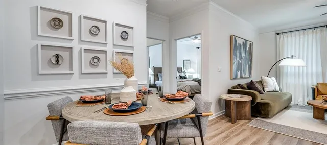 a view of a dining room with furniture and wooden floor