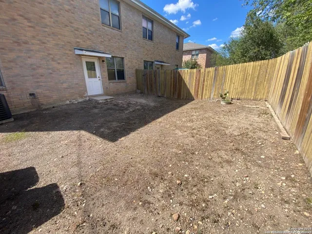 a view of a back yard of the house