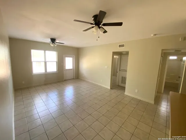 a view of an empty room and window