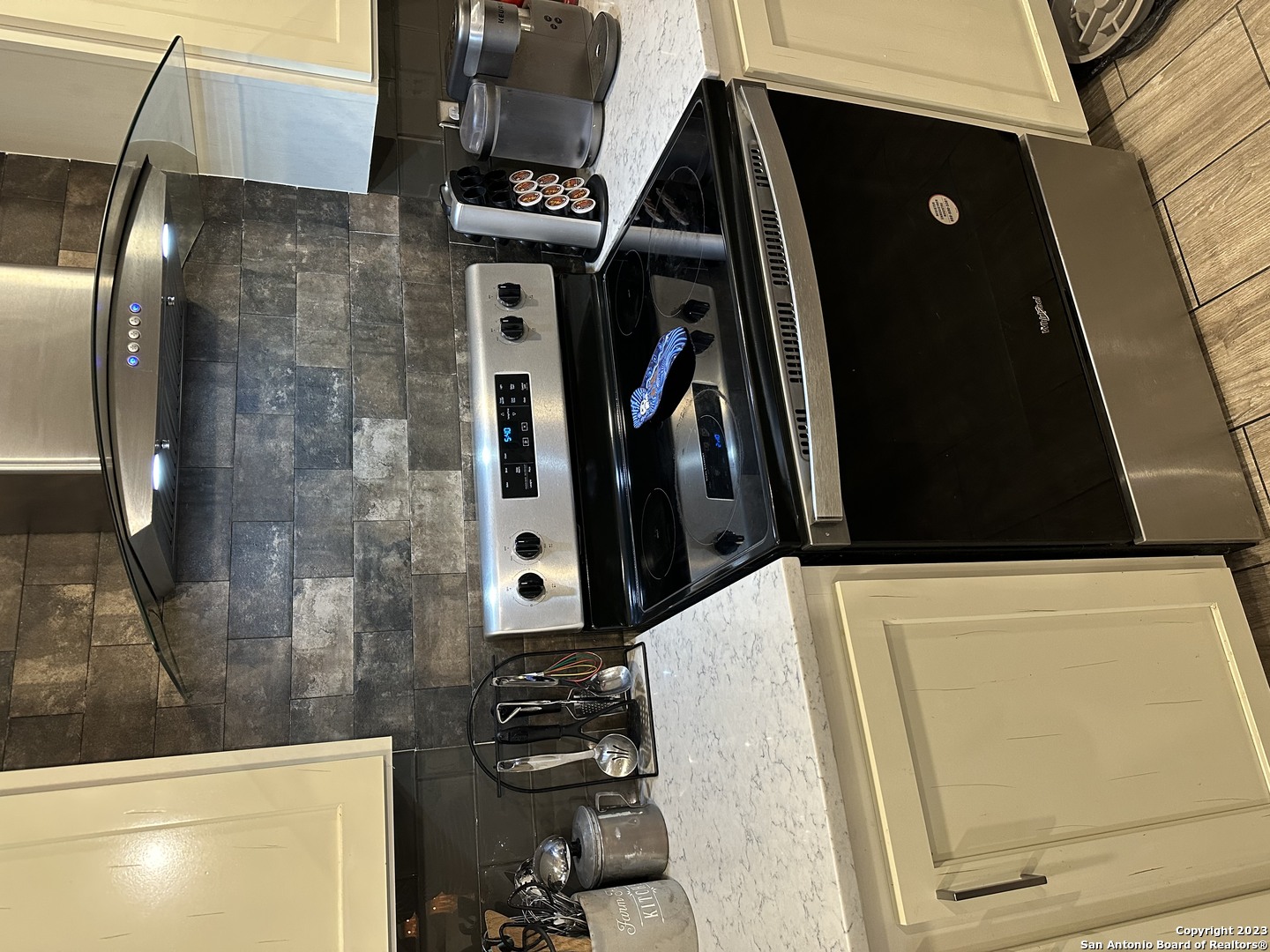 7687 County Road 450 Rocksprings, TX 78880 - Photo 14 of 17 a close view of a sink dishwasher and a refrigerator