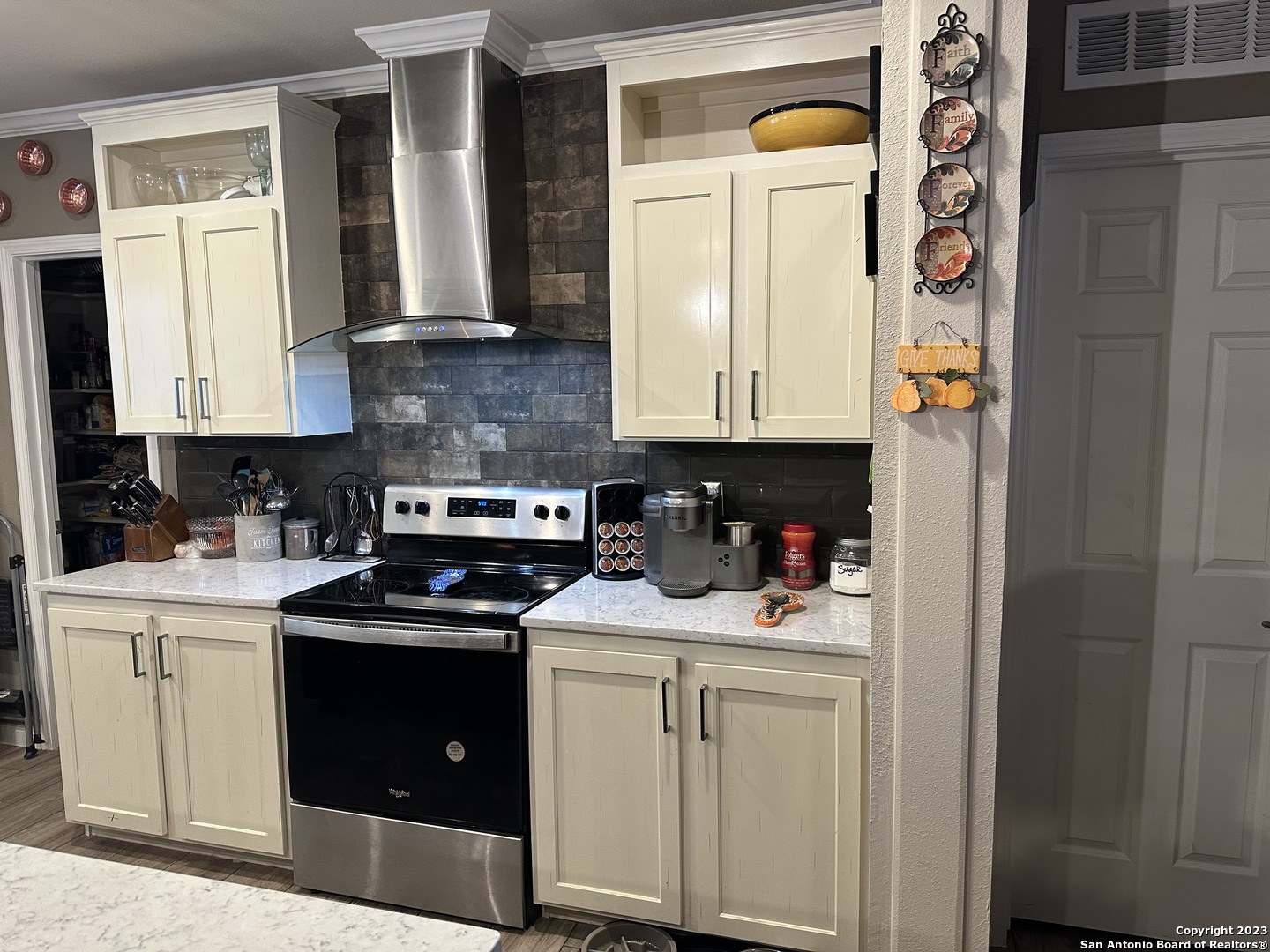 7687 County Road 450 Rocksprings, TX 78880 - Photo 15 of 17 a kitchen with stainless steel appliances granite countertop a stove and a refrigerator