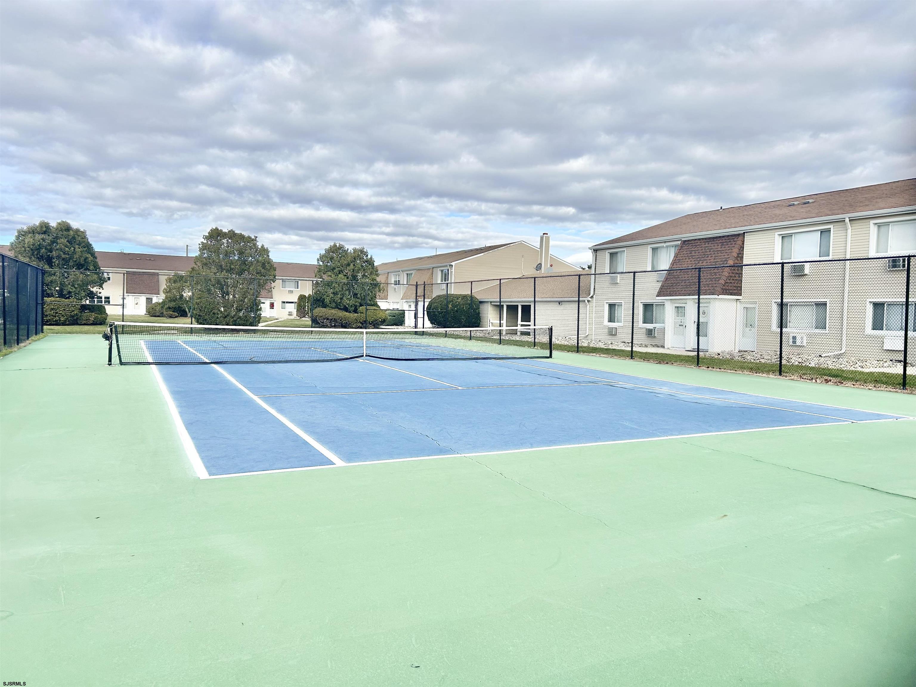4901 Harbor Beach Boulevard, Unit N10 Brigantine, NJ 08203 - Photo 15 of 17 a view of yard with swimming pool and seating