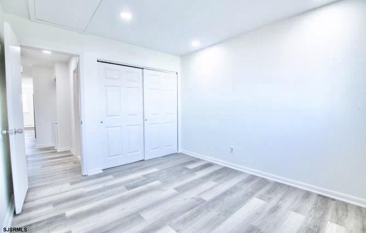 4901 Harbor Beach Boulevard, Unit N10 Brigantine, NJ 08203 - Photo 9 of 17 wooden floor in an empty room