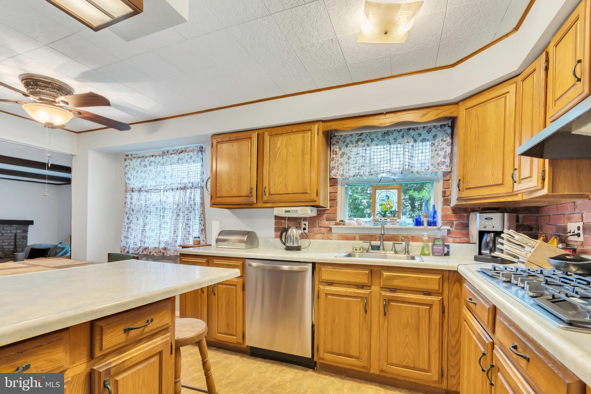 16 Polaris Road Sewell, NJ 08080 - Photo 8 of 19 a kitchen with a sink stove and cabinets