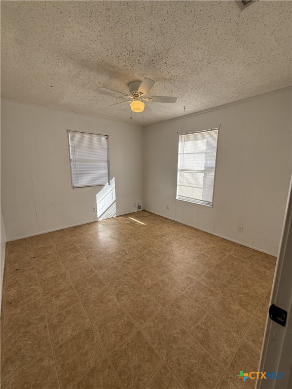 924 Pecan Street Seguin, TX 78155 - Photo 5 of 8 an empty room with windows