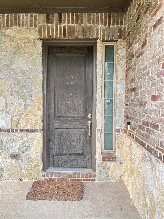 12407 Scottswood Road Frisco, TX 75035 - Photo 14 of 14 Property entrance with stone siding