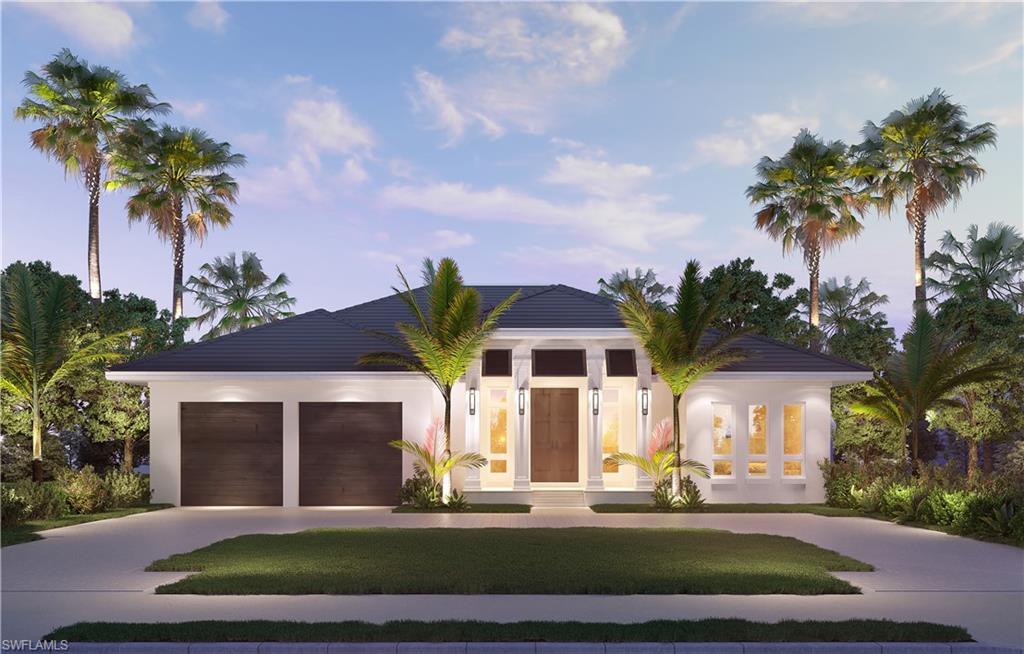 2165 Tarpon Road Naples, FL 34102 - Photo 3 of 24 front view of a house with a yard