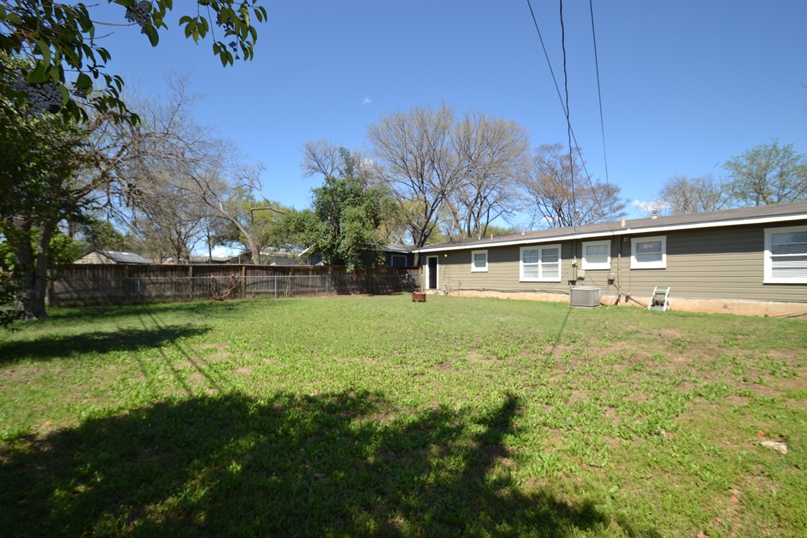 1211 Ridgemont Drive Austin, TX 78723 - Photo 25 of 28 a view of backyard with green space
