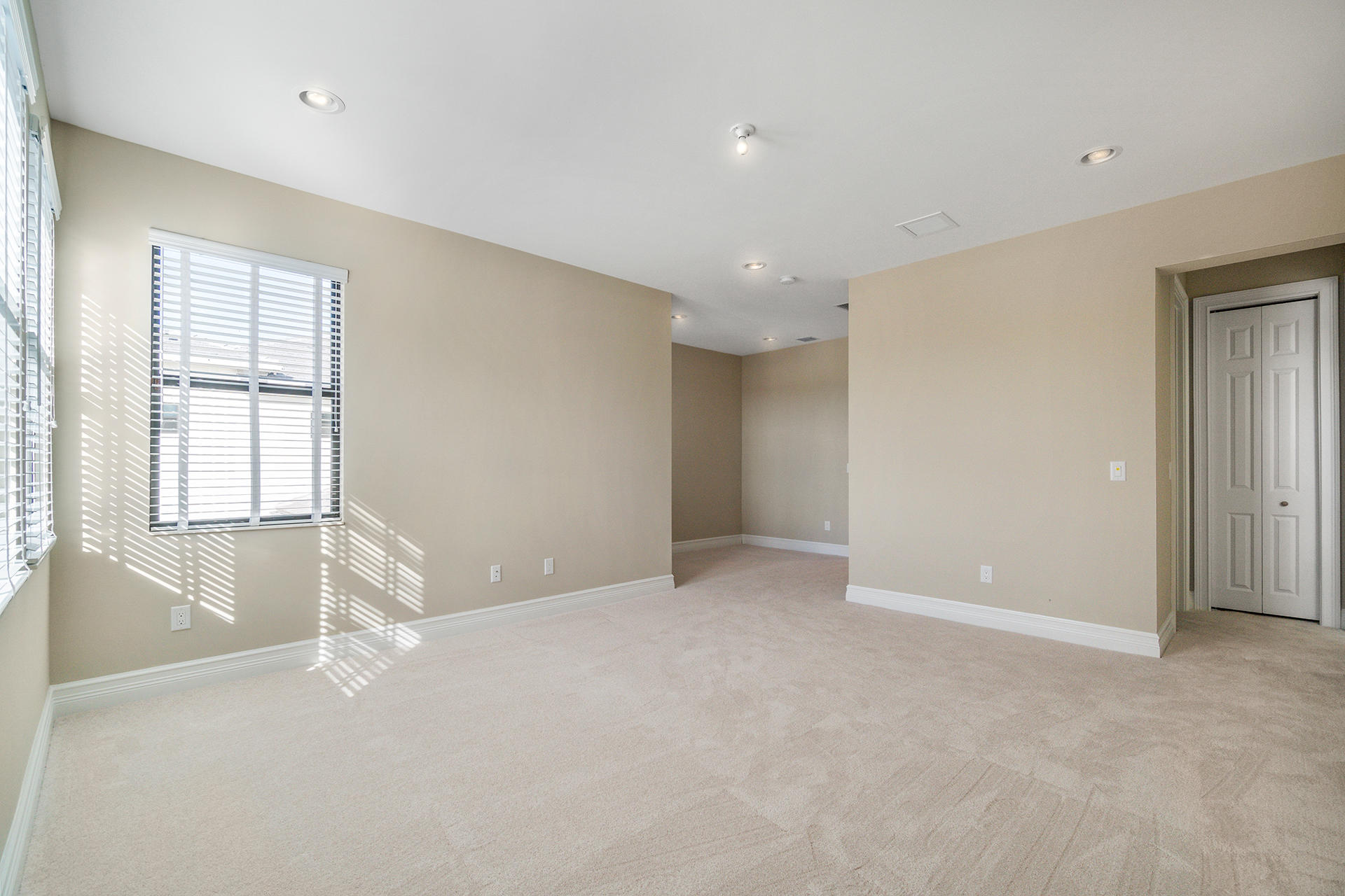 17334 Rosella Road Boca Raton, FL 33496 - Photo 18 of 50 an empty room with windows and closet