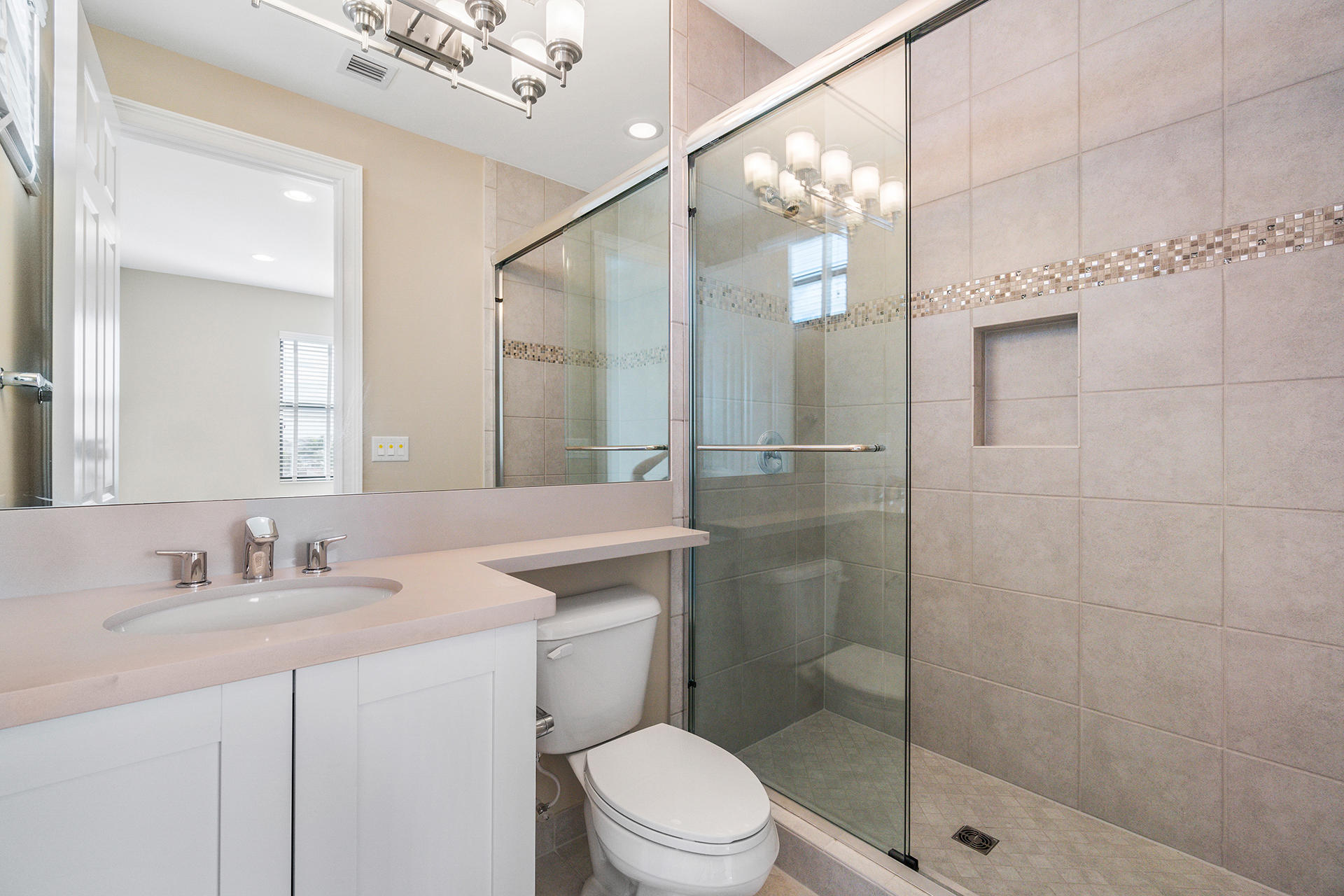 17334 Rosella Road Boca Raton, FL 33496 - Photo 20 of 50 a bathroom with a sink a toilet and shower