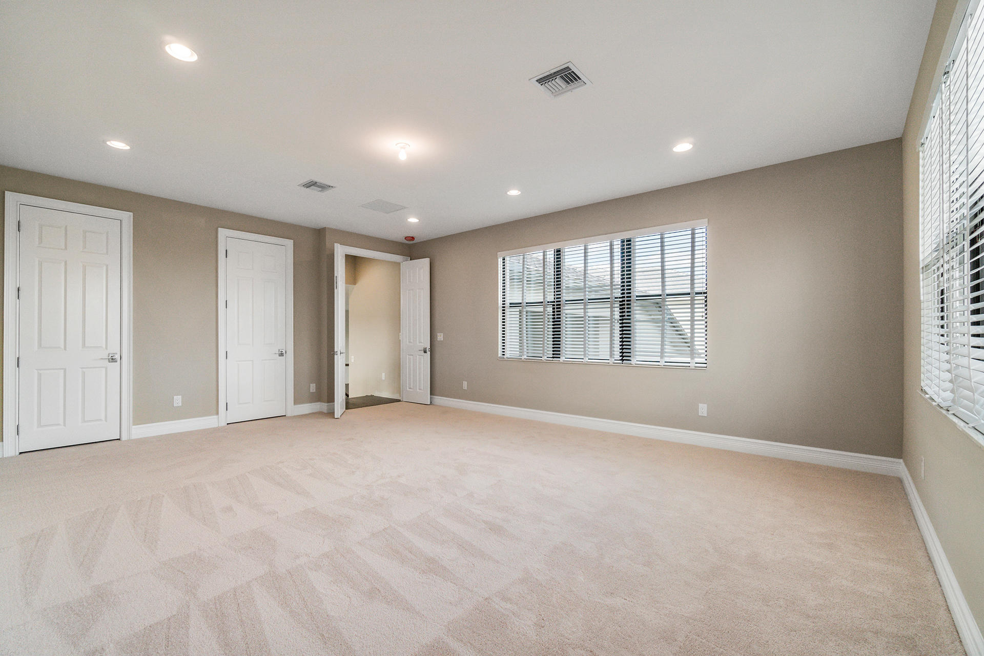 17334 Rosella Road Boca Raton, FL 33496 - Photo 28 of 50 an empty room with windows