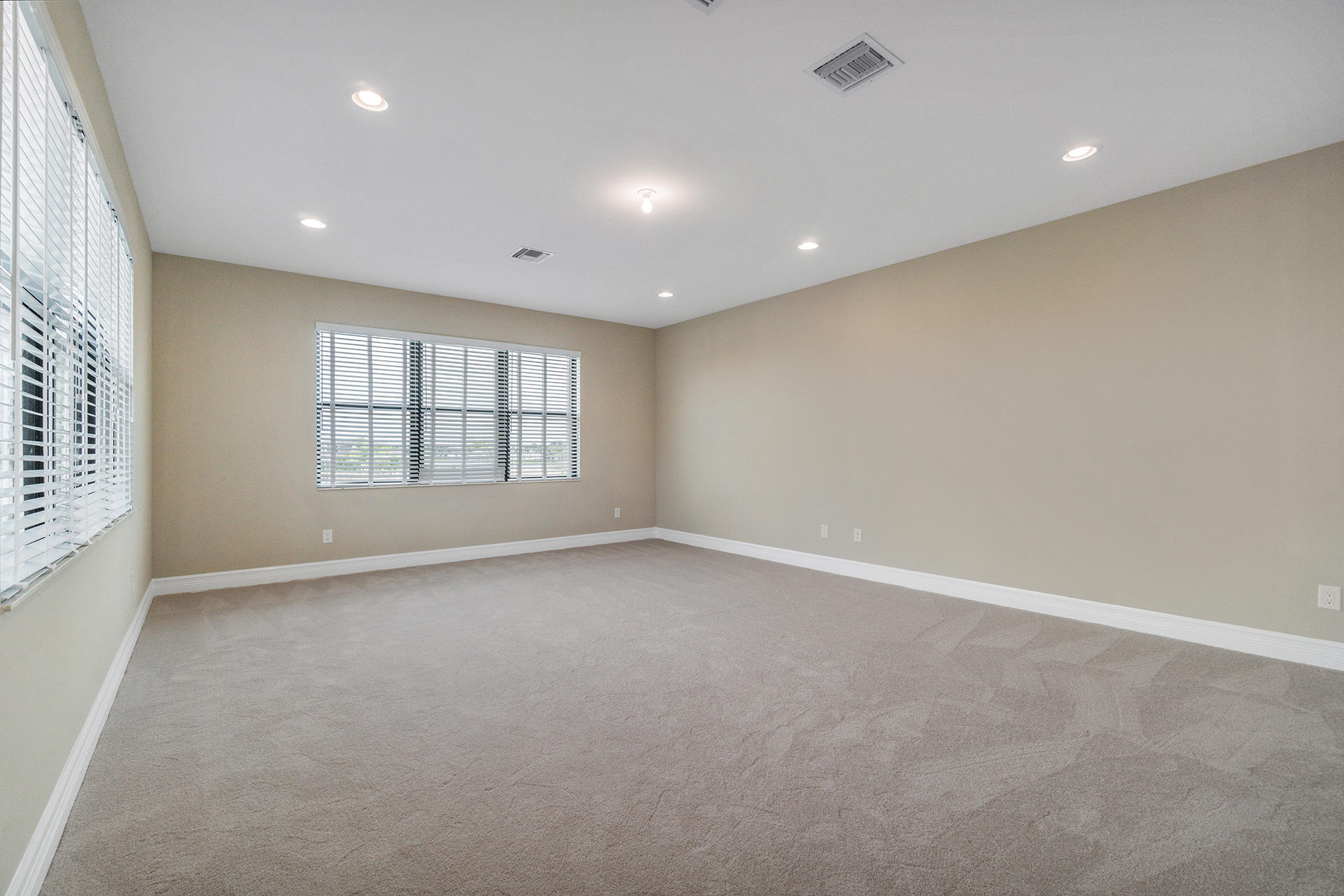 17334 Rosella Road Boca Raton, FL 33496 - Photo 29 of 50 an empty room with windows