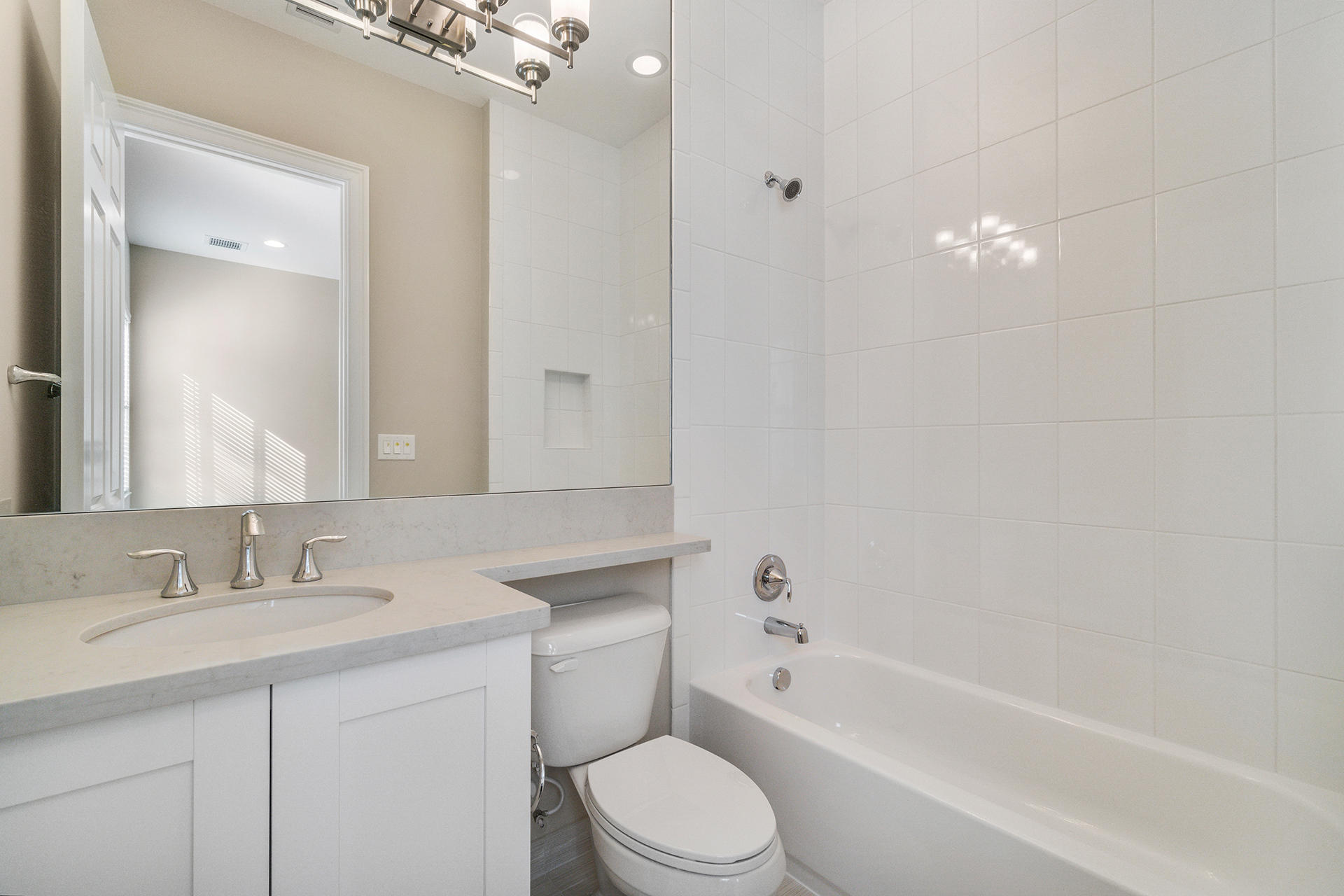 17334 Rosella Road Boca Raton, FL 33496 - Photo 32 of 50 a bathroom with a toilet a sink a mirror a bathtub and vanity