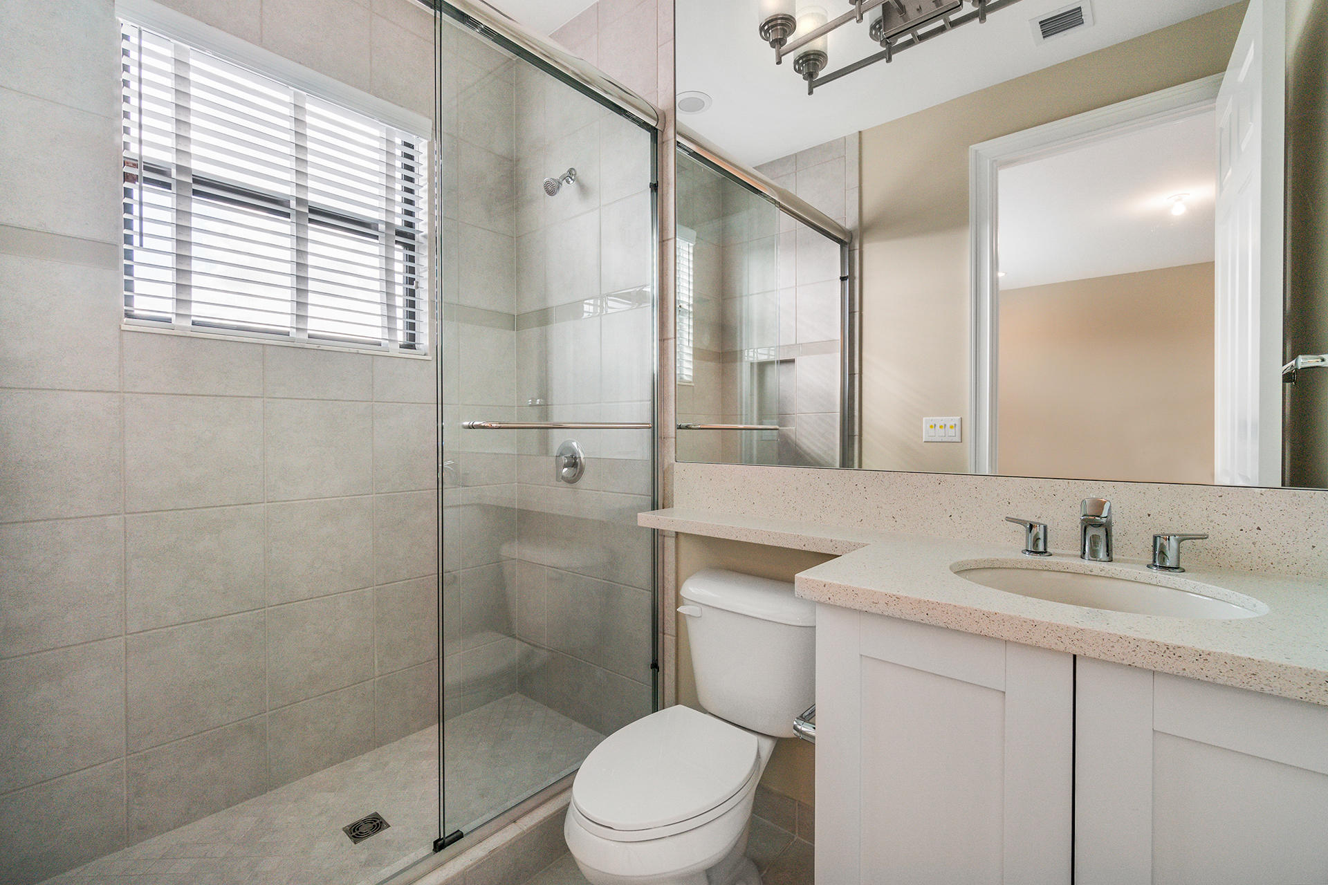 17334 Rosella Road Boca Raton, FL 33496 - Photo 33 of 50 a bathroom with a sink a toilet and shower