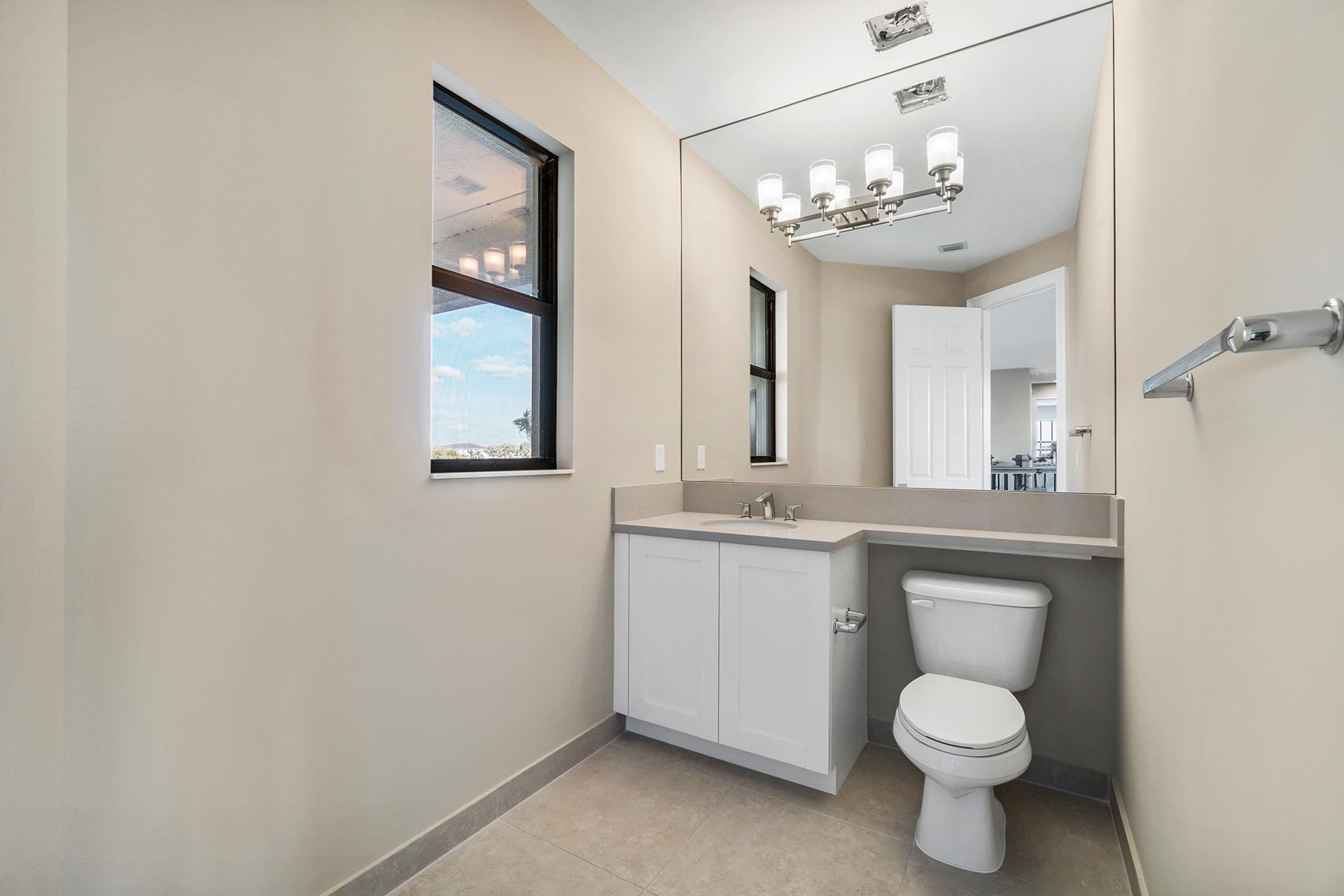 17334 Rosella Road Boca Raton, FL 33496 - Photo 35 of 50 a bathroom with a toilet sink and mirror