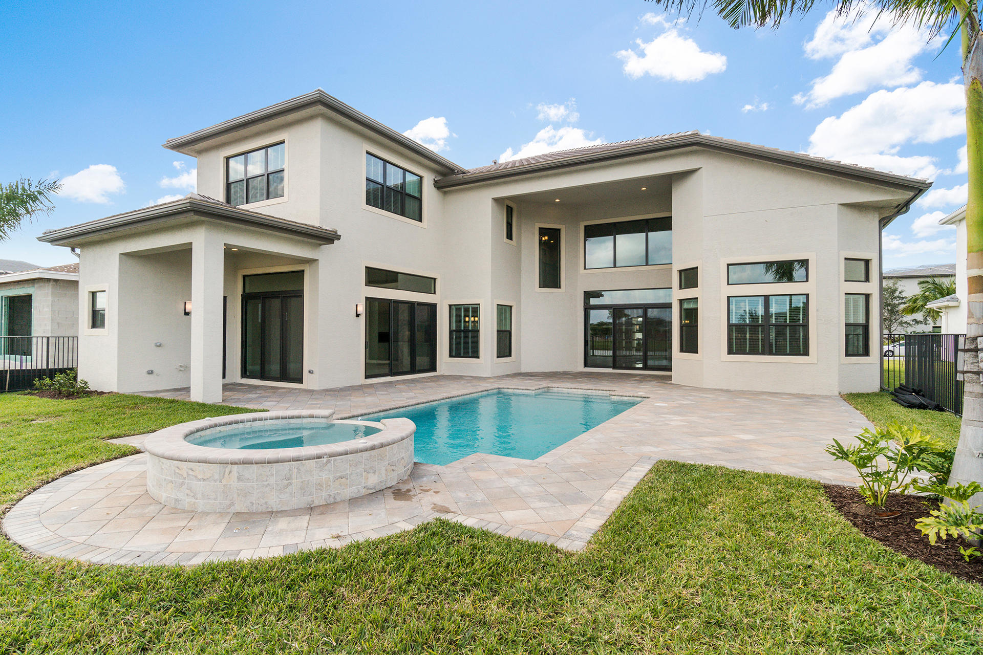 17334 Rosella Road Boca Raton, FL 33496 - Photo 38 of 50 a front view of a house with a yard