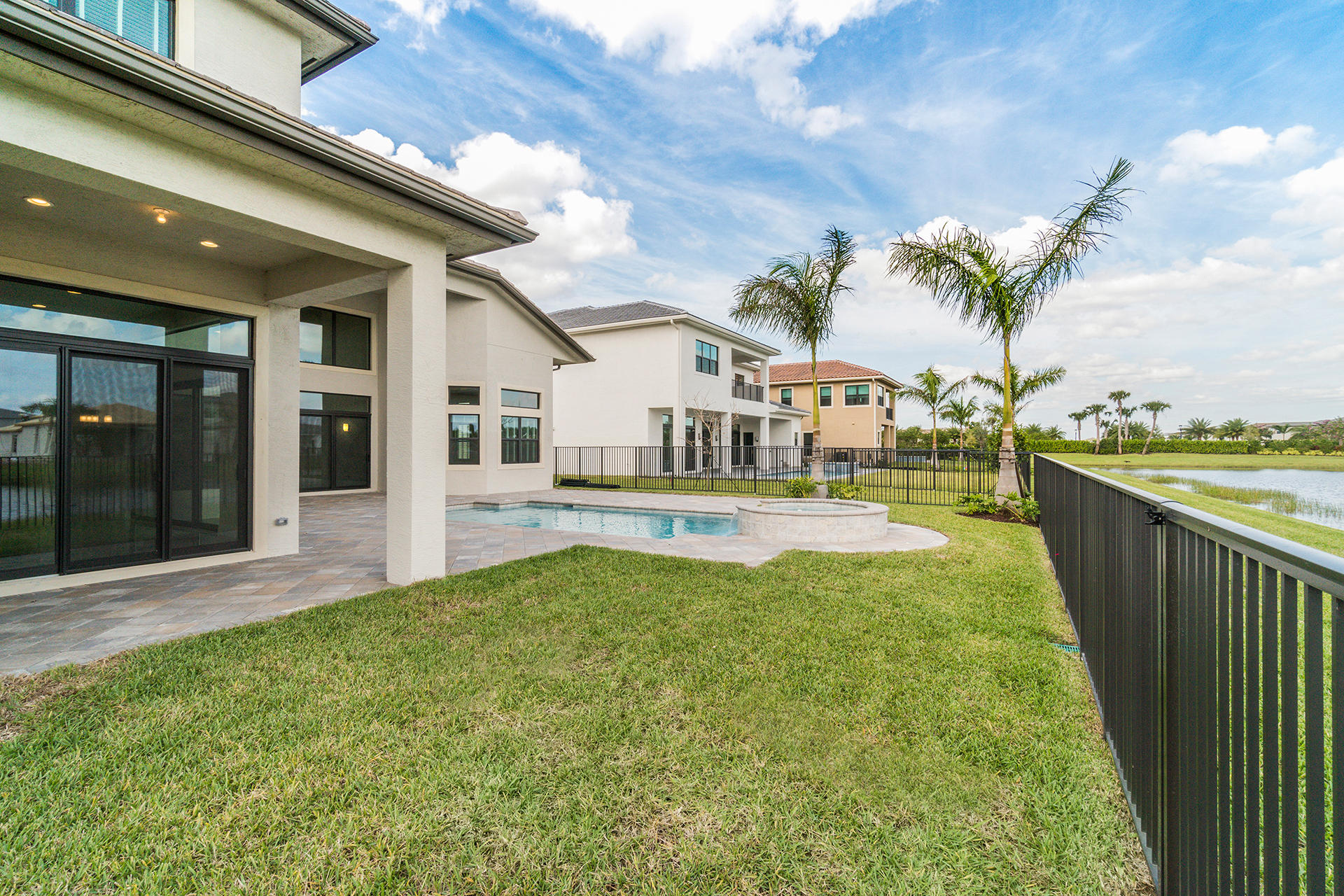 17334 Rosella Road Boca Raton, FL 33496 - Photo 39 of 50 a swimming pool with outdoor seating and yard
