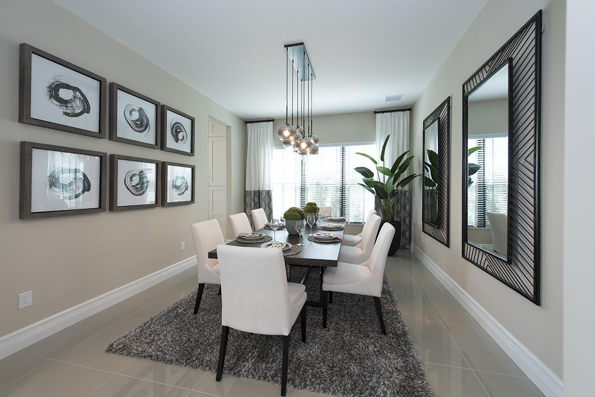 17334 Rosella Road Boca Raton, FL 33496 - Photo 4 of 50 a dining room with furniture a chandelier and wooden floor