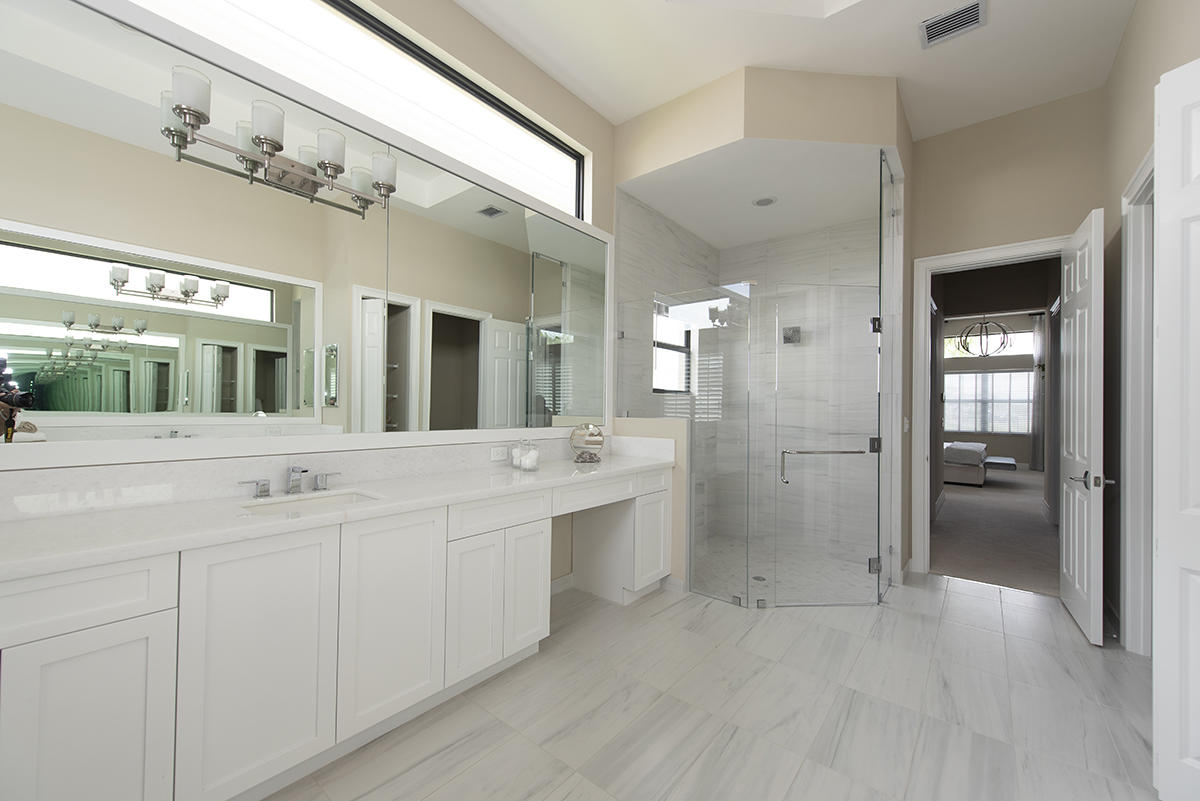 17334 Rosella Road Boca Raton, FL 33496 - Photo 8 of 50 a bathroom with a double vanity sink mirror and shower