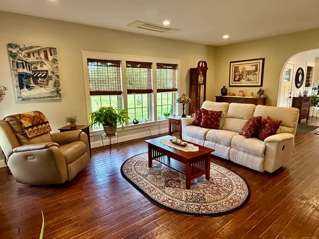 a living room with furniture and a rug