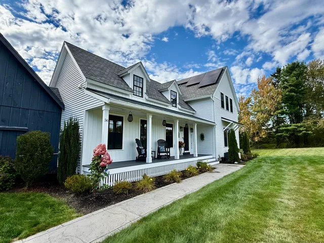 a view of a house with outdoor space porch and garden