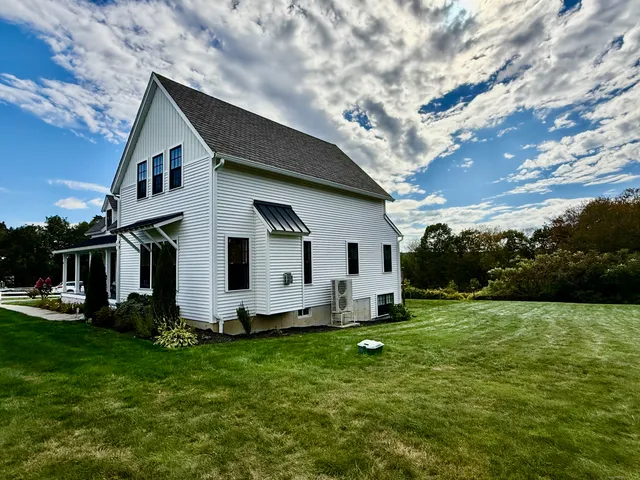 a front view of house with garden