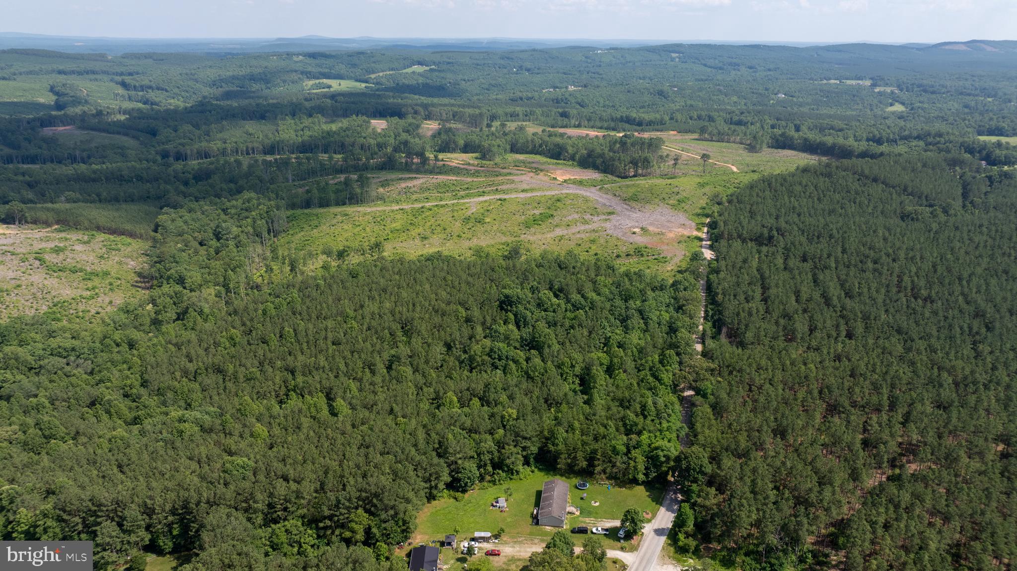 Tbd Springfield Road, Unit 1 Meherrin, VA 23954 - Photo 9 of 19 a view of a lake with green field and mountains