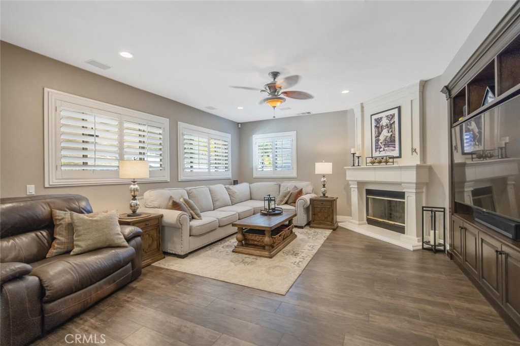 30177 Sagecrest Way Castaic, CA 91384 - Photo 11 of 54 a living room with furniture a fireplace and a flat screen tv