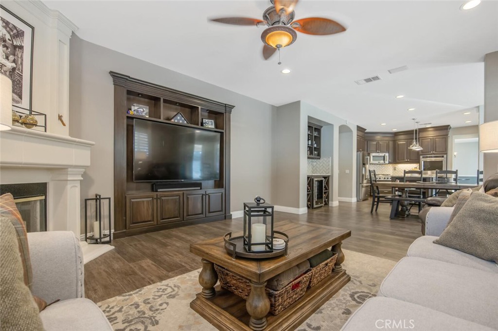 30177 Sagecrest Way Castaic, CA 91384 - Photo 12 of 54 a living room with furniture a flat screen tv and kitchen view