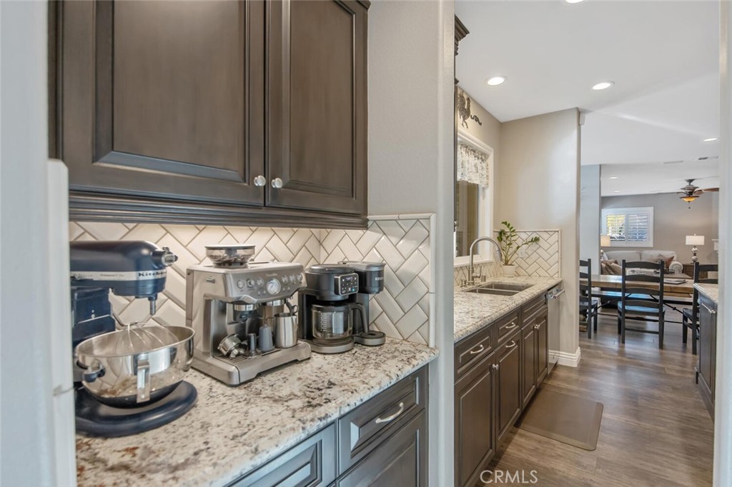 30177 Sagecrest Way Castaic, CA 91384 - Photo 15 of 54 a kitchen with granite countertop stove and cabinets