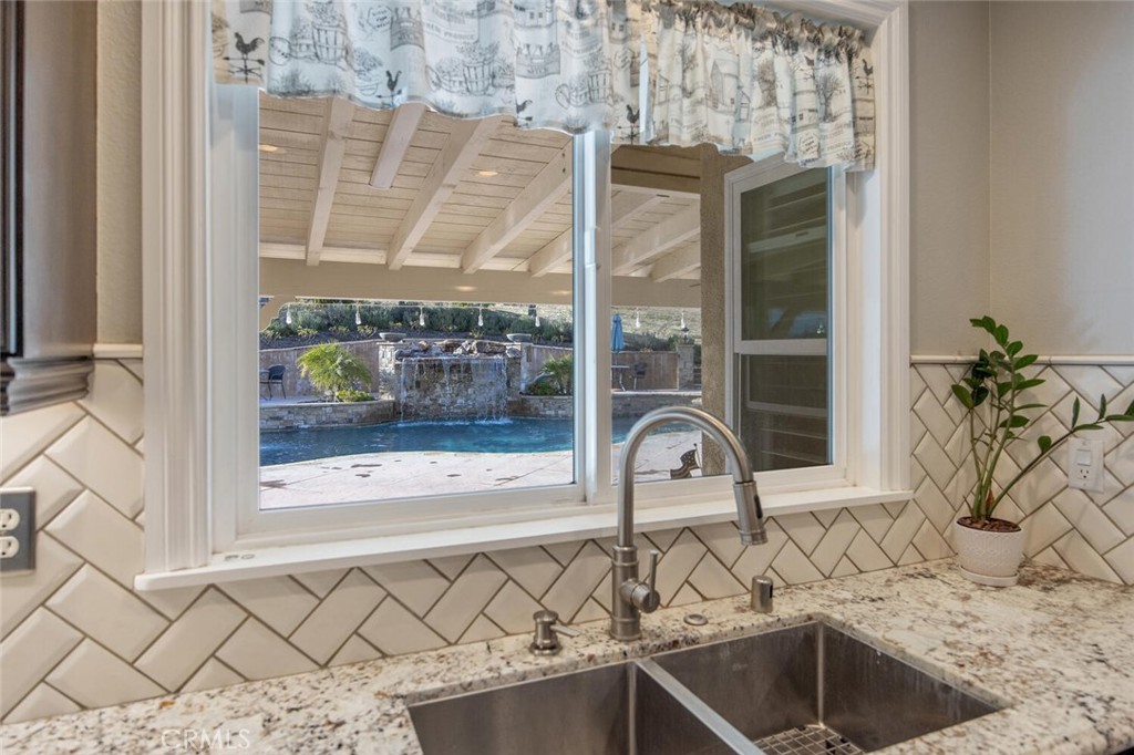 30177 Sagecrest Way Castaic, CA 91384 - Photo 17 of 54 a bathroom with a granite countertop sink and a window