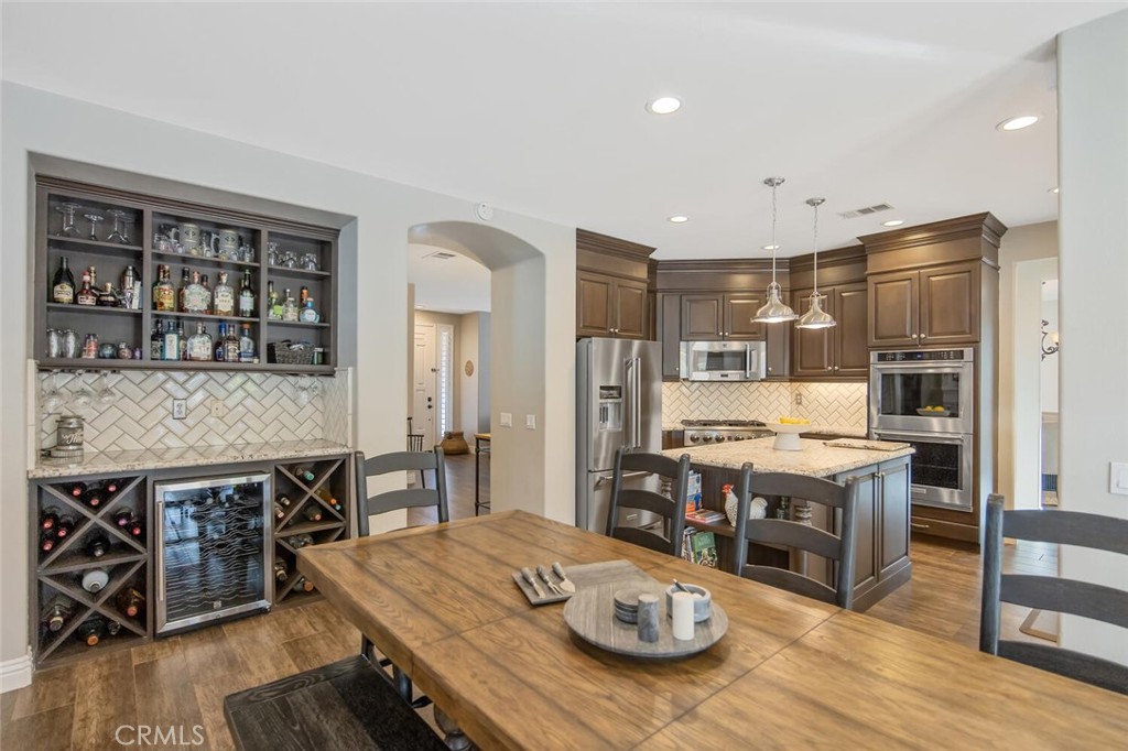 30177 Sagecrest Way Castaic, CA 91384 - Photo 18 of 54 a open kitchen with stainless steel appliances granite countertop a stove and a refrigerator