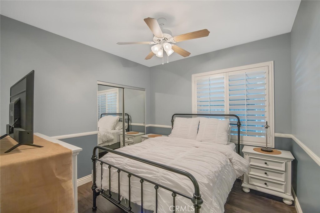 30177 Sagecrest Way Castaic, CA 91384 - Photo 21 of 54 a bedroom with a bed and a chandelier
