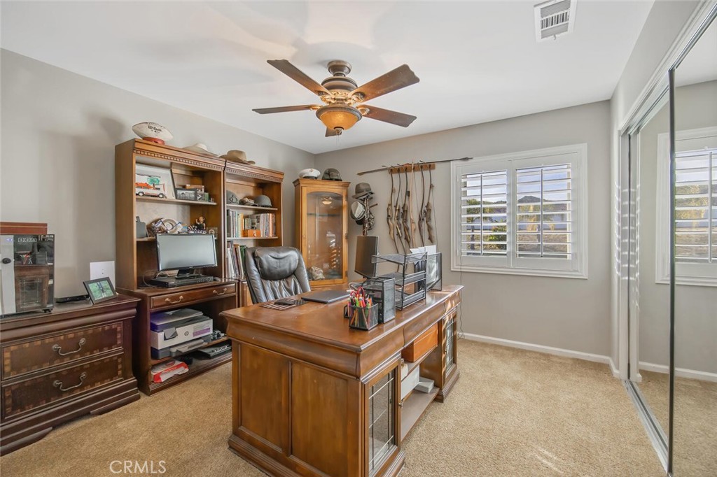 30177 Sagecrest Way Castaic, CA 91384 - Photo 31 of 54 a view of a workspace with furniture and a window