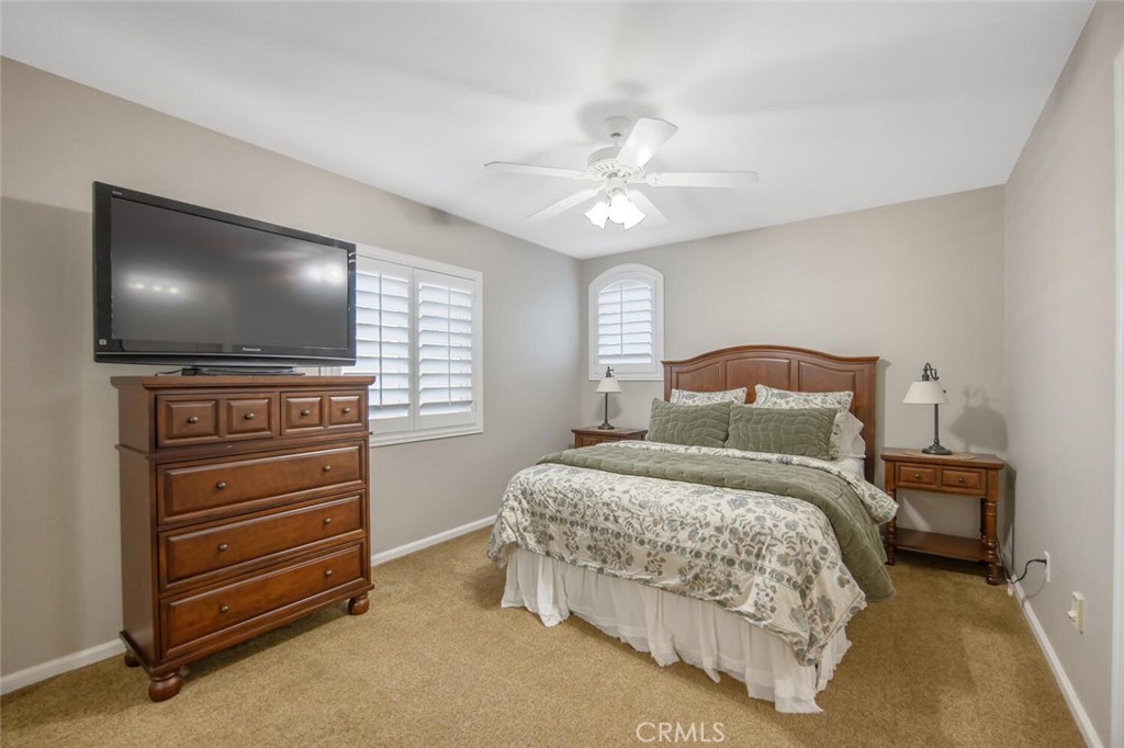 30177 Sagecrest Way Castaic, CA 91384 - Photo 32 of 54 a bedroom with a bed and a flat screen tv