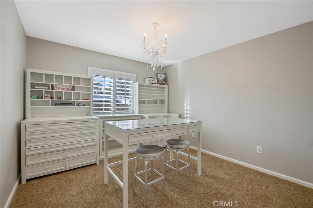 30177 Sagecrest Way Castaic, CA 91384 - Photo 34 of 54 a kitchen with a table and chairs