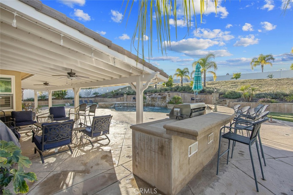 30177 Sagecrest Way Castaic, CA 91384 - Photo 39 of 54 a view of a patio with table and chairs and potted plants
